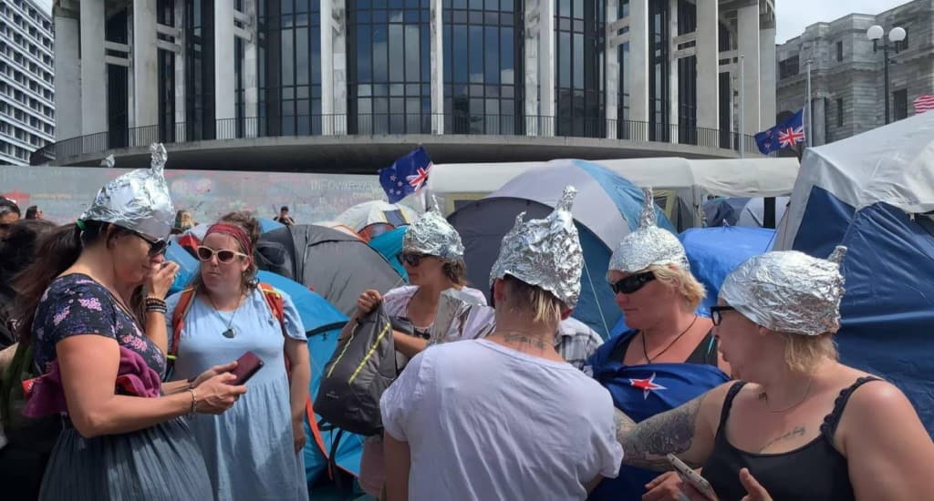 protestors in tinfoil hats