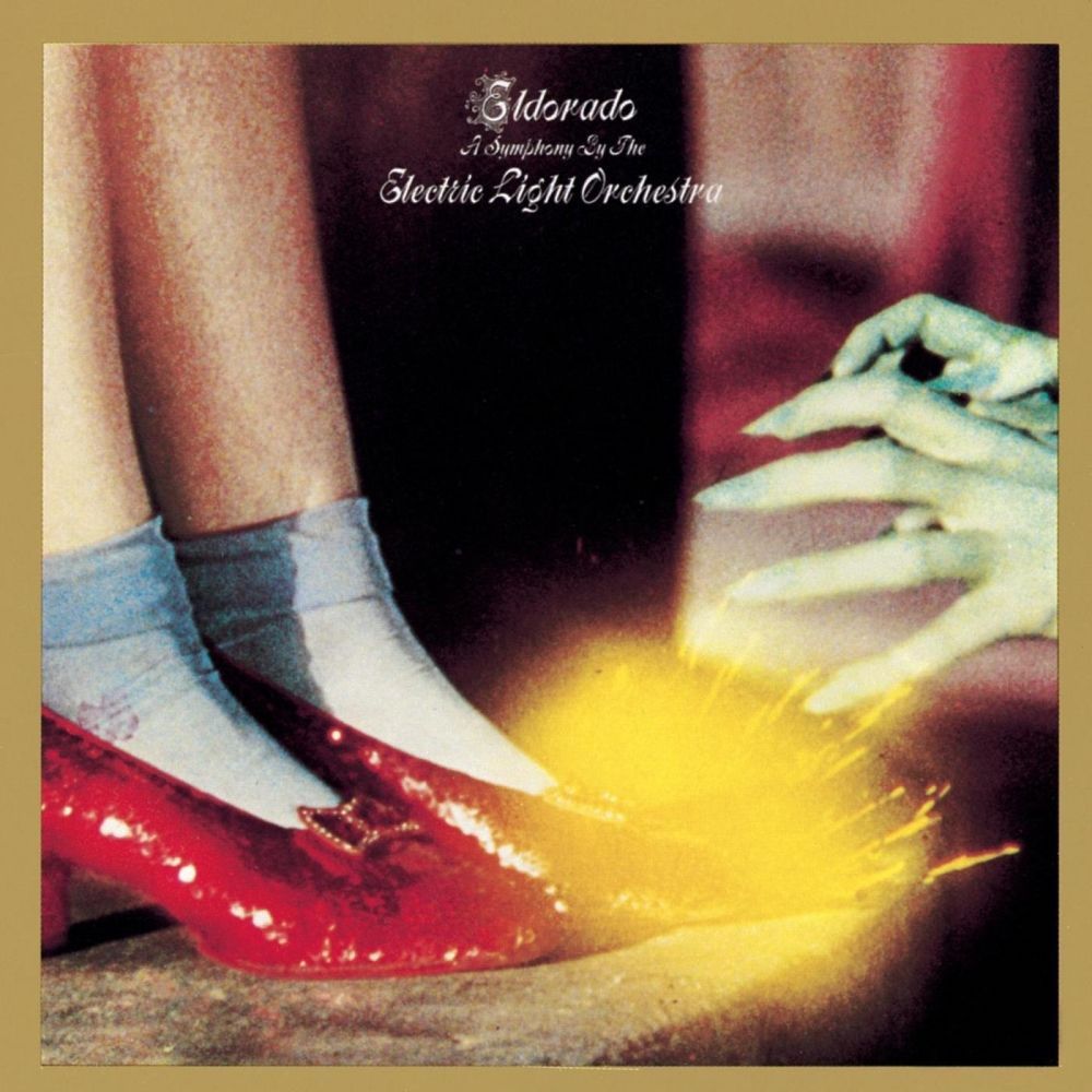 Cover of Electric Light Orchestra ELO's Eldorado - A symphony by the Electric Light Orchestra. Cover is the hands of the wicked witch and Dorothy's red shoes